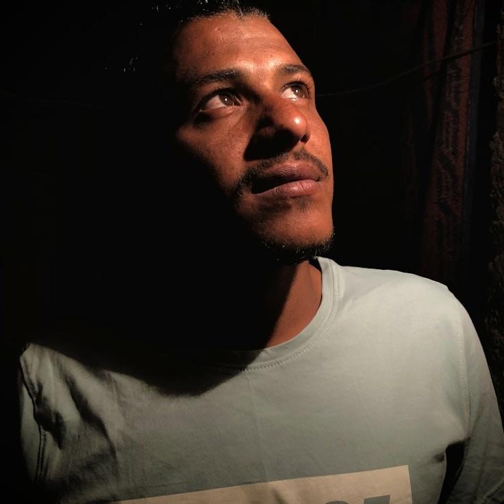 Alex Carter, Lead Design Curator at Twilight Grove Paper, reviewing corporate floral arrangements